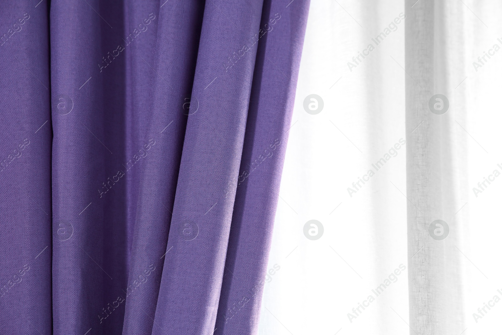 Window with beautiful blue violet curtains. Interior design Image of Window with beautiful blue violet curtains. Interior design