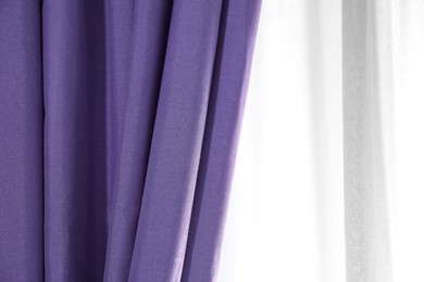 Image of Window with beautiful blue violet curtains. Interior design