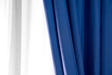 Image of Window with beautiful blue curtains. Interior design
