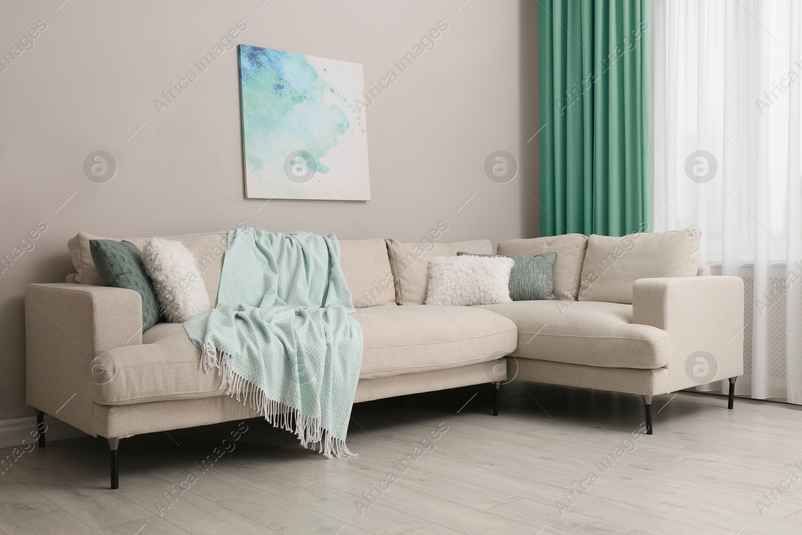 Comfortable sofa near window with mint color curtains in room. Interior design Image of Comfortable sofa near window with mint color curtains in room. Interior design