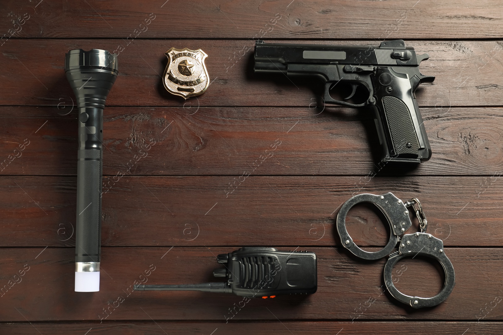 Different police equipment on wooden table, flat lay. Space for text Photo of Different police equipment on wooden table, flat lay. Space for text