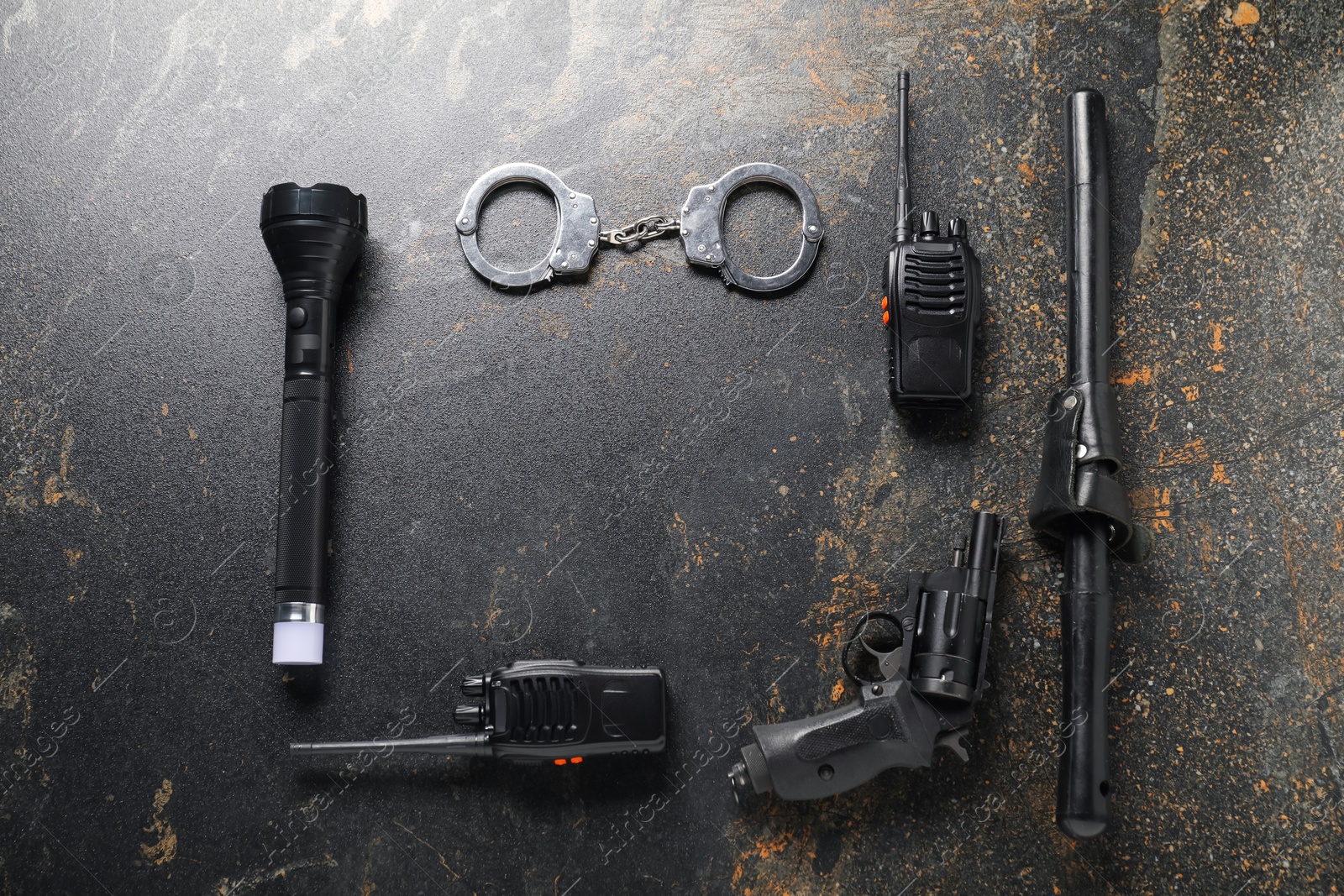 Different police equipment on dark table, flat lay. Space for text Photo of Different police equipment on dark table, flat lay. Space for text