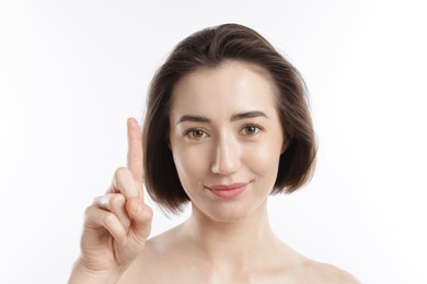 Photo of Woman with contact lens on white background