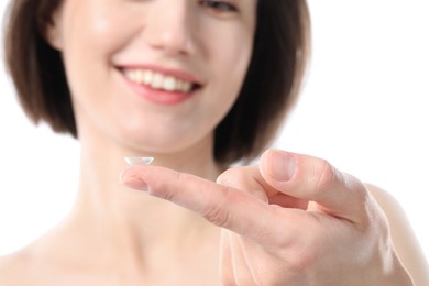 Photo of Woman with contact lens on white background, closeup