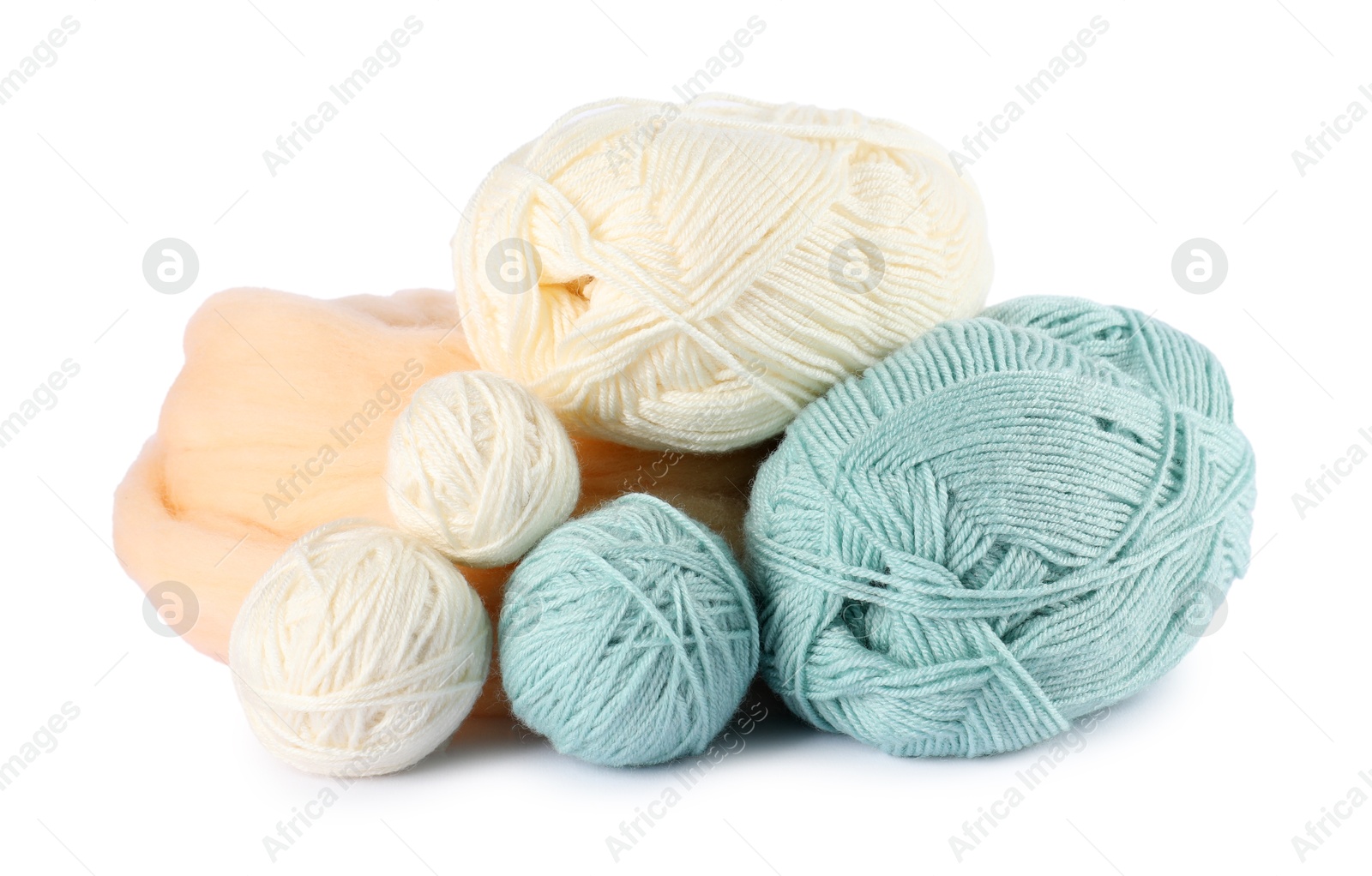 Felting wool and knitting yarn isolated on white Photo of Felting wool and knitting yarn isolated on white