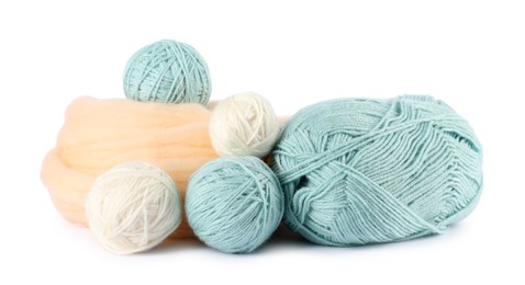 Photo of Felting wool and knitting yarn isolated on white