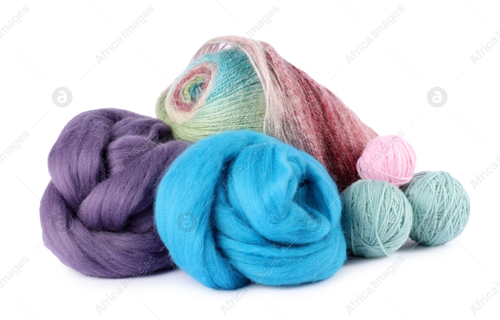 Felting wool and knitting yarn isolated on white Photo of Felting wool and knitting yarn isolated on white