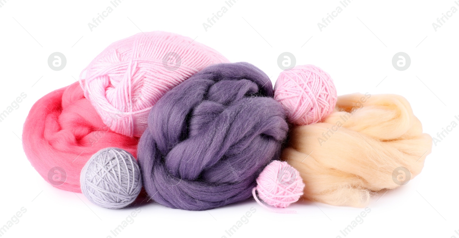 Felting wool and knitting yarn isolated on white Photo of Felting wool and knitting yarn isolated on white