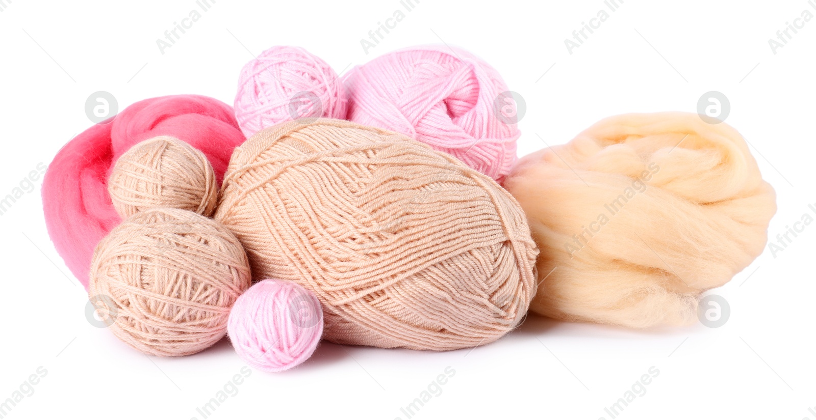 Felting wool and knitting yarn isolated on white Photo of Felting wool and knitting yarn isolated on white