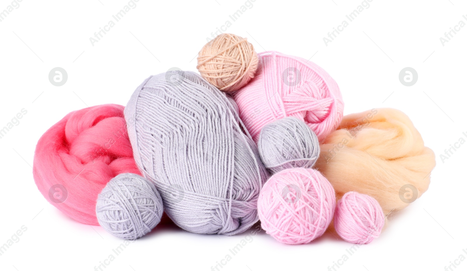 Felting wool and knitting yarn isolated on white Photo of Felting wool and knitting yarn isolated on white