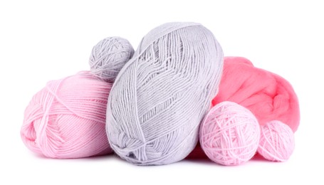 Photo of Felting wool and knitting yarn isolated on white