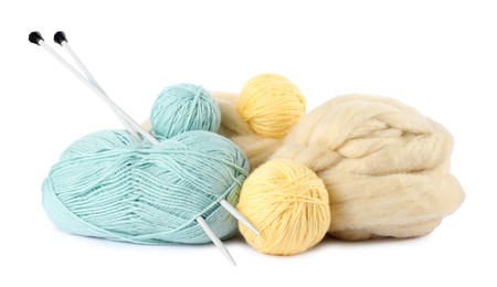 Photo of Felting wool and knitting yarn with needles isolated on white