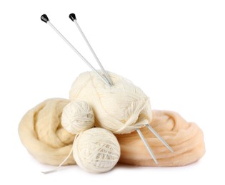 Photo of Felting wool and knitting yarn with needles isolated on white