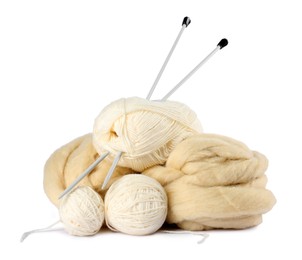 Photo of Felting wool and knitting yarn with needles isolated on white