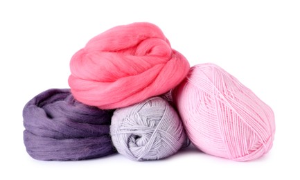 Photo of Felting wool and knitting yarn isolated on white