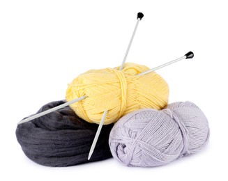 Photo of Felting wool and knitting yarn with needles isolated on white