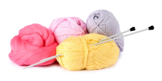 Photo of Felting wool and knitting yarn with needles isolated on white