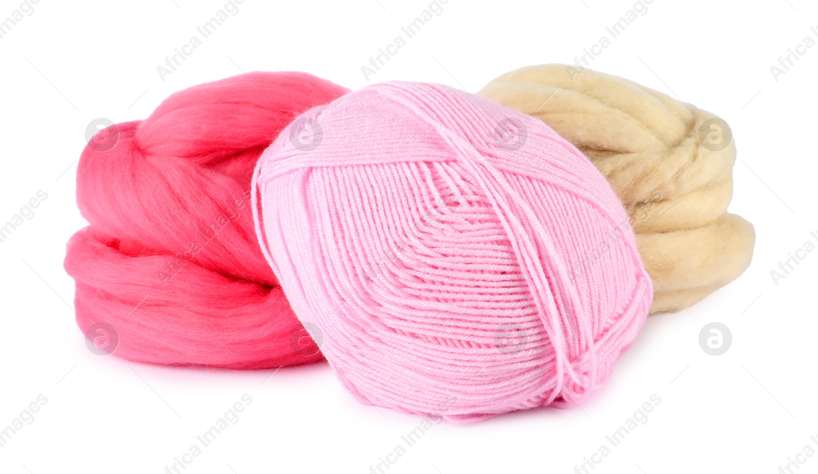 Felting wool and knitting yarn isolated on white Photo of Felting wool and knitting yarn isolated on white