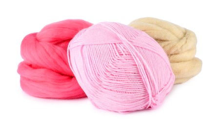Photo of Felting wool and knitting yarn isolated on white