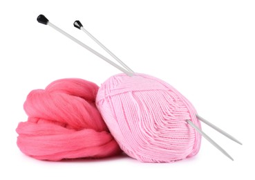 Photo of Felting wool and knitting yarn with needles isolated on white