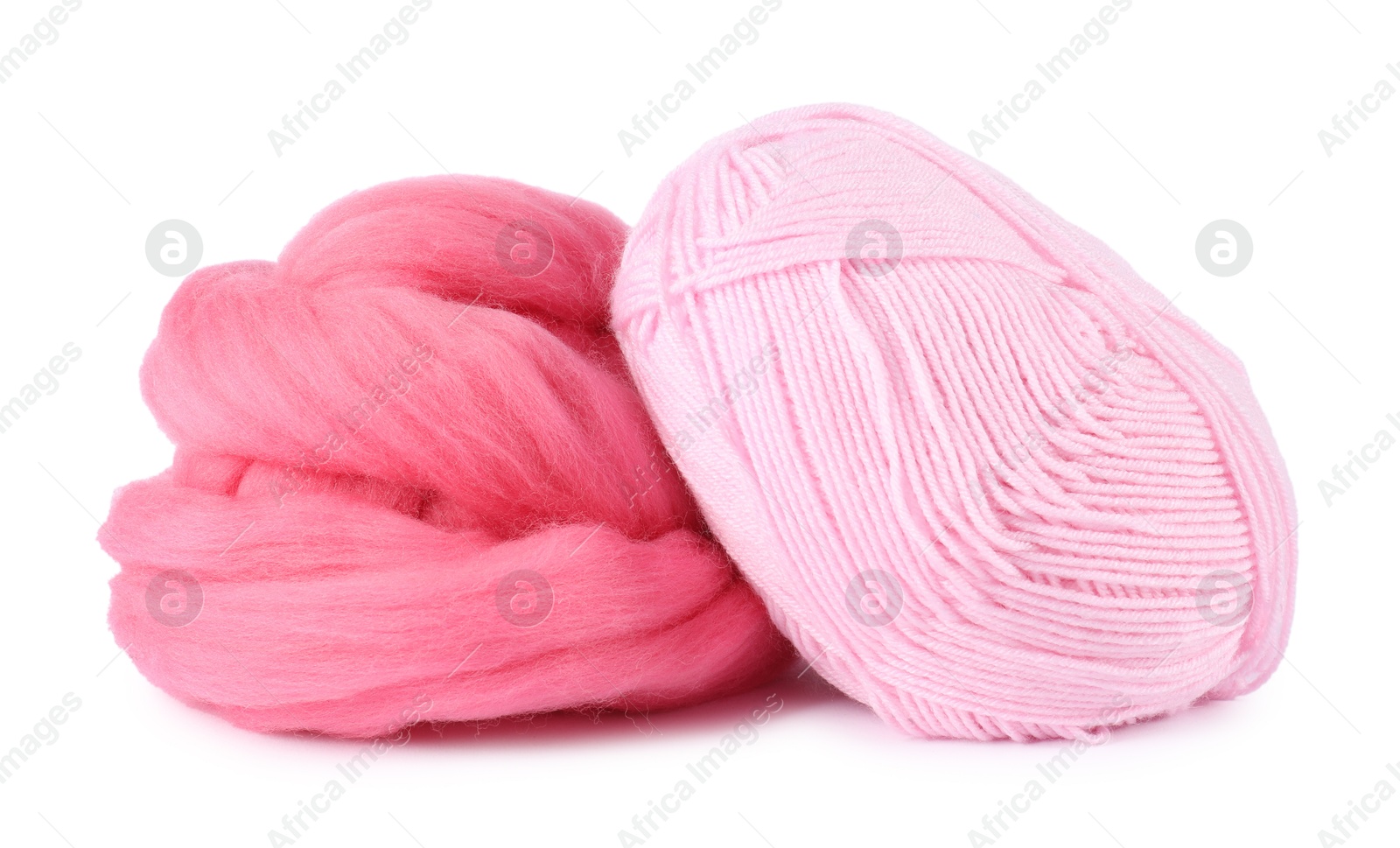 Felting wool and knitting yarn isolated on white Photo of Felting wool and knitting yarn isolated on white
