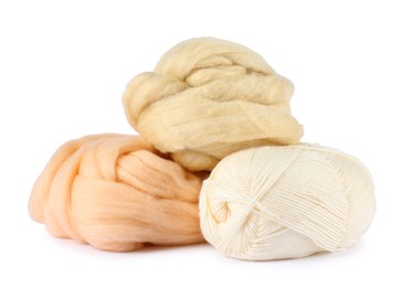 Photo of Felting wool and knitting yarn isolated on white