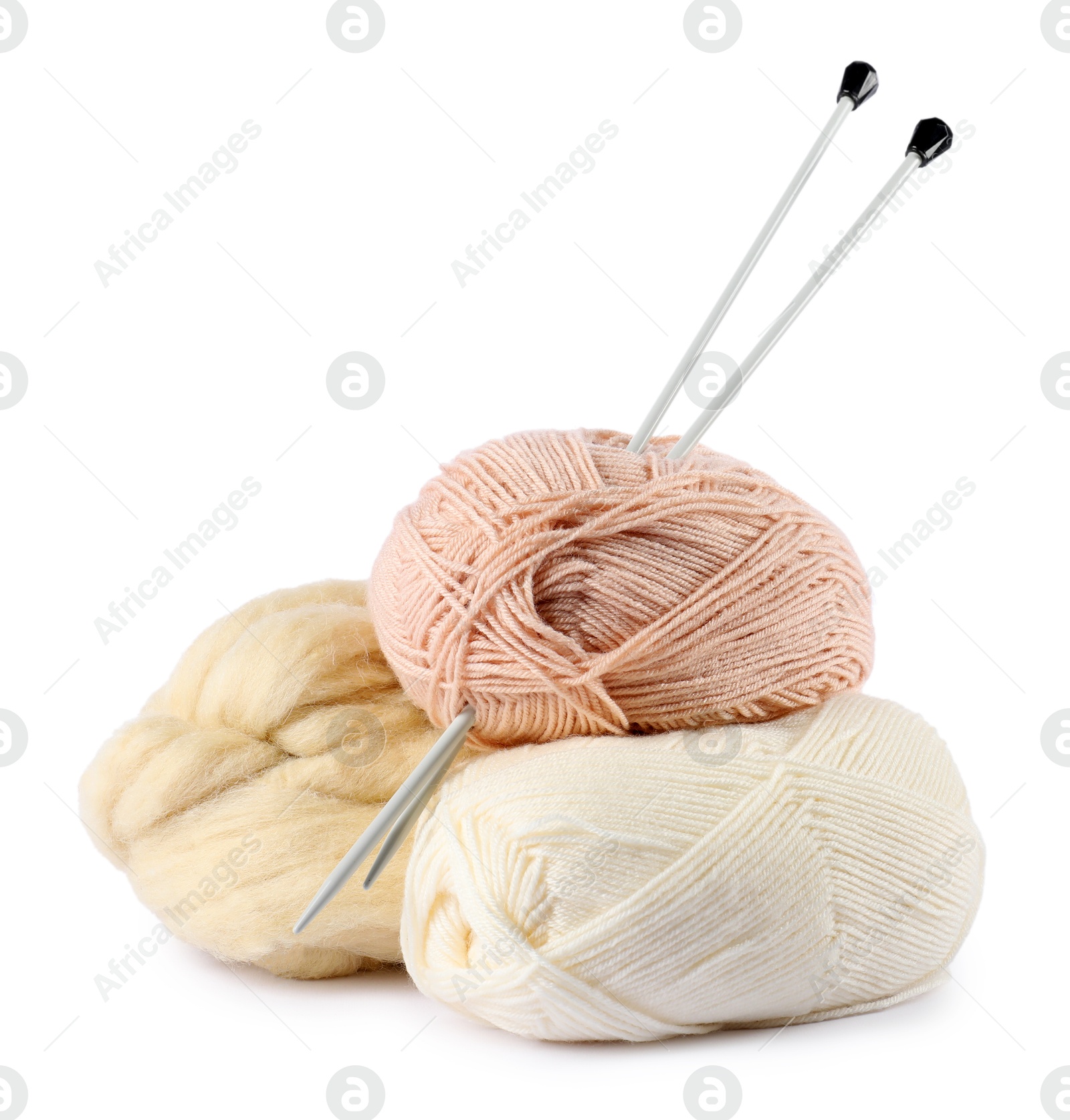 Felting wool and knitting yarn with needles isolated on white Photo of Felting wool and knitting yarn with needles isolated on white