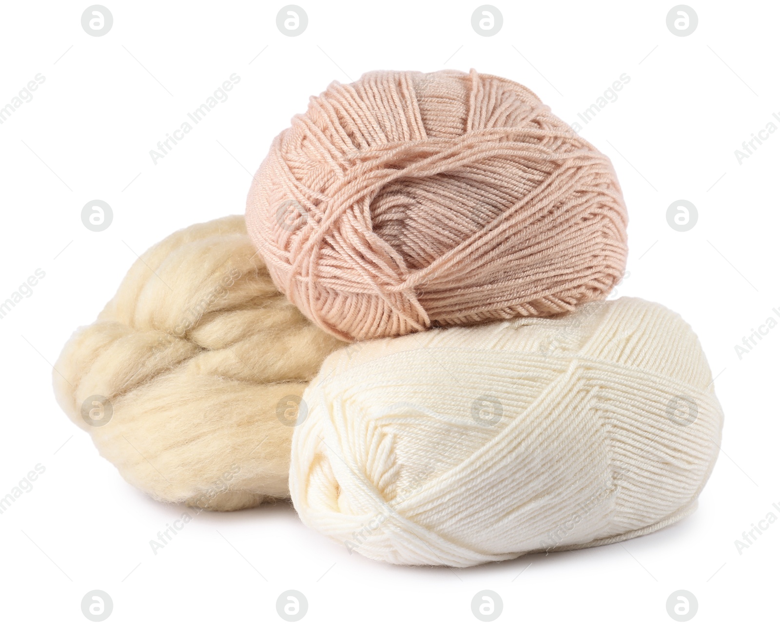 Felting wool and knitting yarn isolated on white Photo of Felting wool and knitting yarn isolated on white