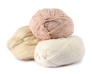 Photo of Felting wool and knitting yarn isolated on white