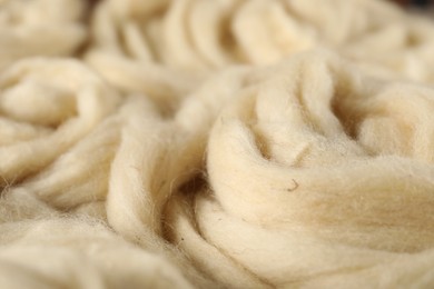 Photo of Natural felting wool as background, closeup view
