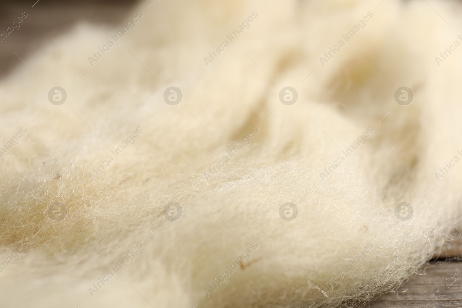 Natural felting wool on wooden background, closeup Photo of Natural felting wool on wooden background, closeup