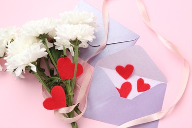 Photo of Love letters, red hearts, ribbon and flowers on pink background, flat lay