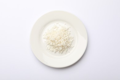 Photo of Pile of rice and plate on white table, top view