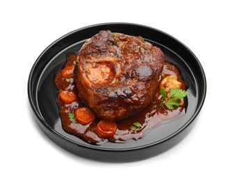 Photo of Tasty beef ossobuco with carrot, parsley and sauce isolated on white
