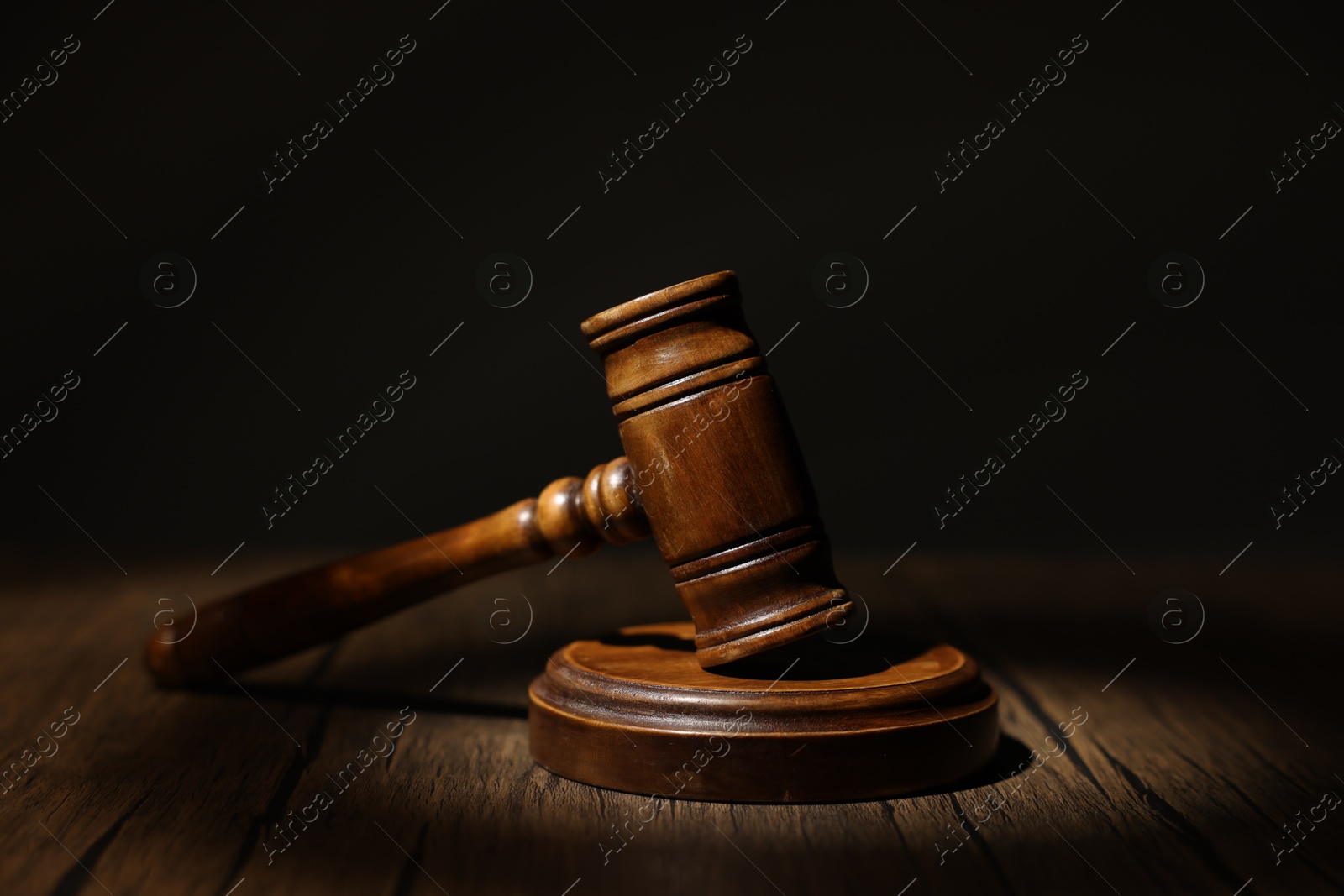 Judge's gavel on wooden table in office, closeup Photo of Judge's gavel on wooden table in office, closeup