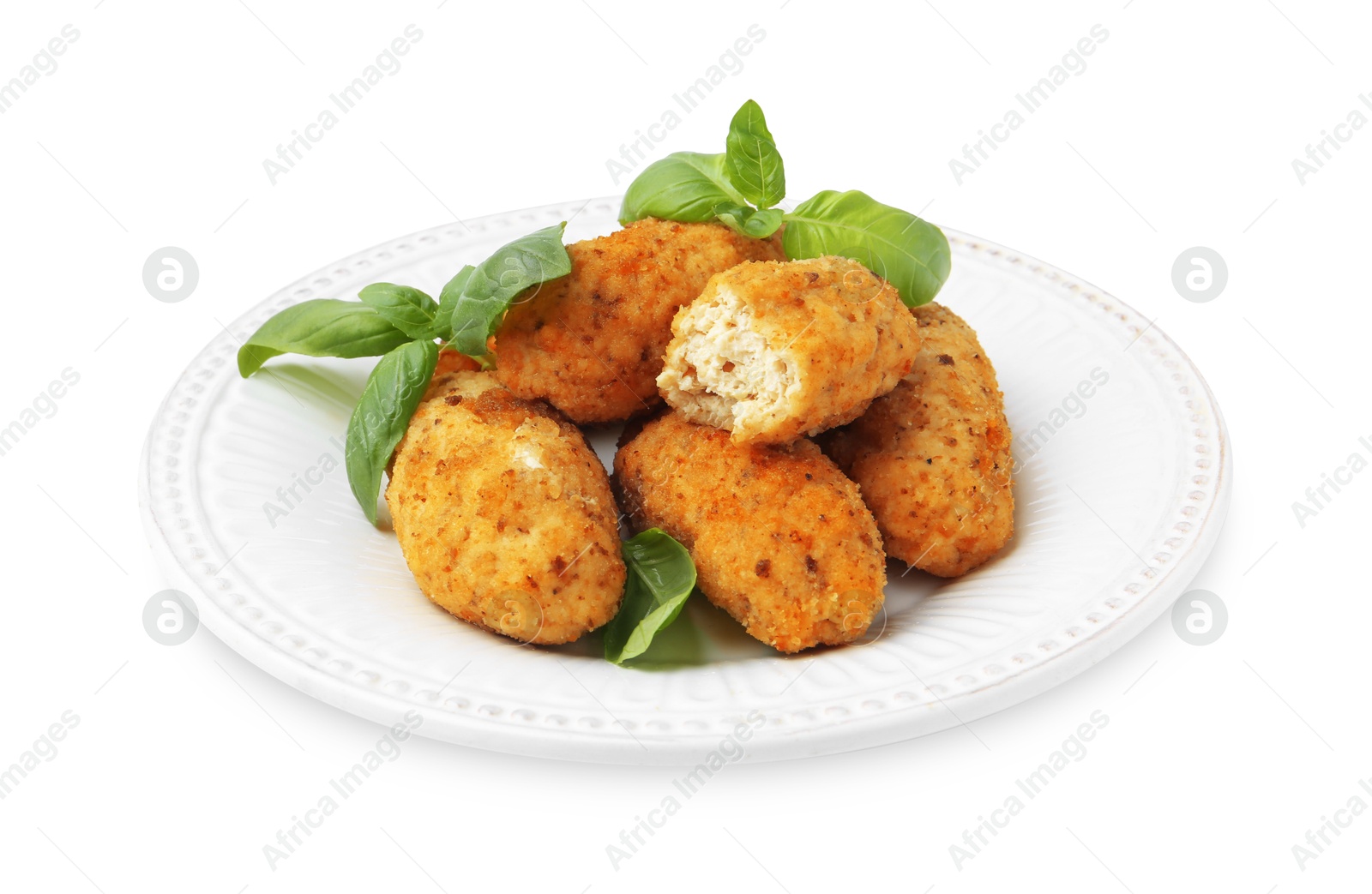 Tasty fried croquettes and basil isolated on white Photo of Tasty fried croquettes and basil isolated on white