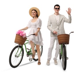 Image of Handsome man and beautiful woman with bicycles on white background