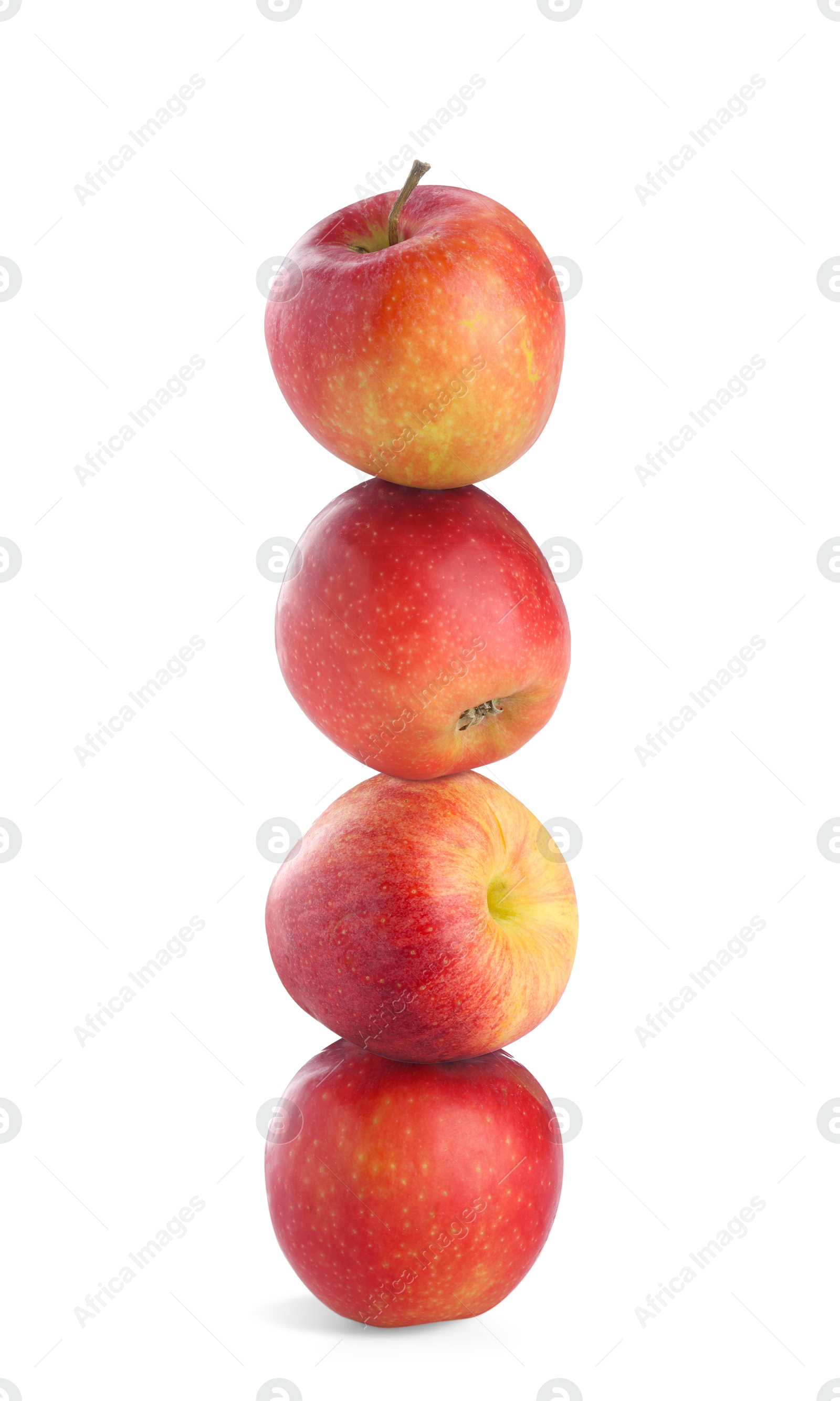 Apples stacked on top of each other against white background. Balance Image of Apples stacked on top of each other against white background. Balance