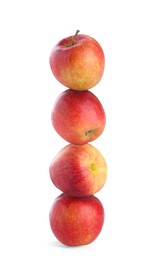 Image of Apples stacked on top of each other against white background. Balance