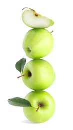 Image of Green apples stacked on top of each other against white background. Balance
