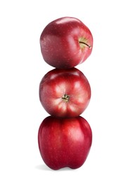 Image of Red apples stacked on top of each other against white background. Balance