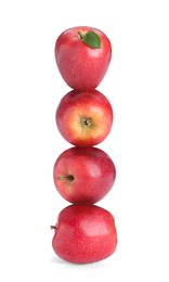 Image of Red apples stacked on top of each other against white background. Balance