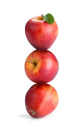 Image of Red apples stacked on top of each other against white background. Balance