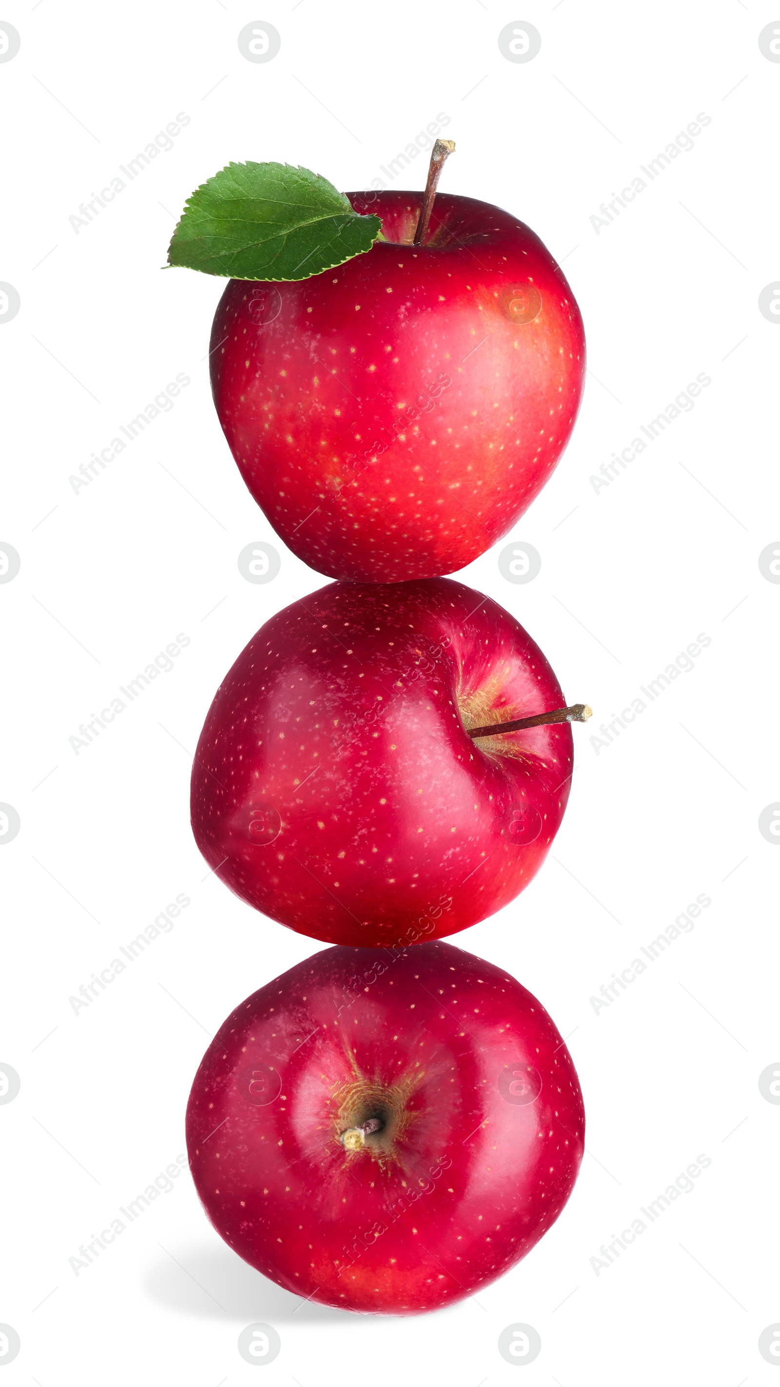Red apples stacked on top of each other against white background. Balance Image of Red apples stacked on top of each other against white background. Balance