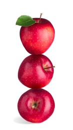 Image of Red apples stacked on top of each other against white background. Balance