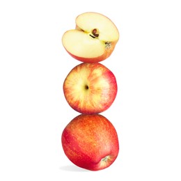 Image of Apples stacked on top of each other against white background. Balance