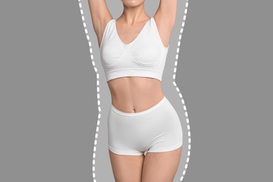 Image of Slim woman showing her perfect body on grey background, closeup. Outline of previous overweight figure around. Healthy lifestyle