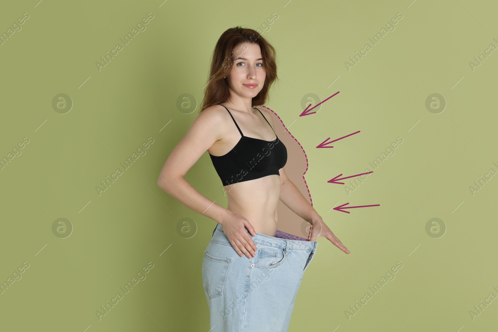 Slim woman with perfect body in oversized jeans on olive color background. Outline of previous overweight figure around. Result of healthy lifestyle Image of Slim woman with perfect body in oversized jeans on olive color background. Outline of previous overweight figure around. Result of healthy lifestyle