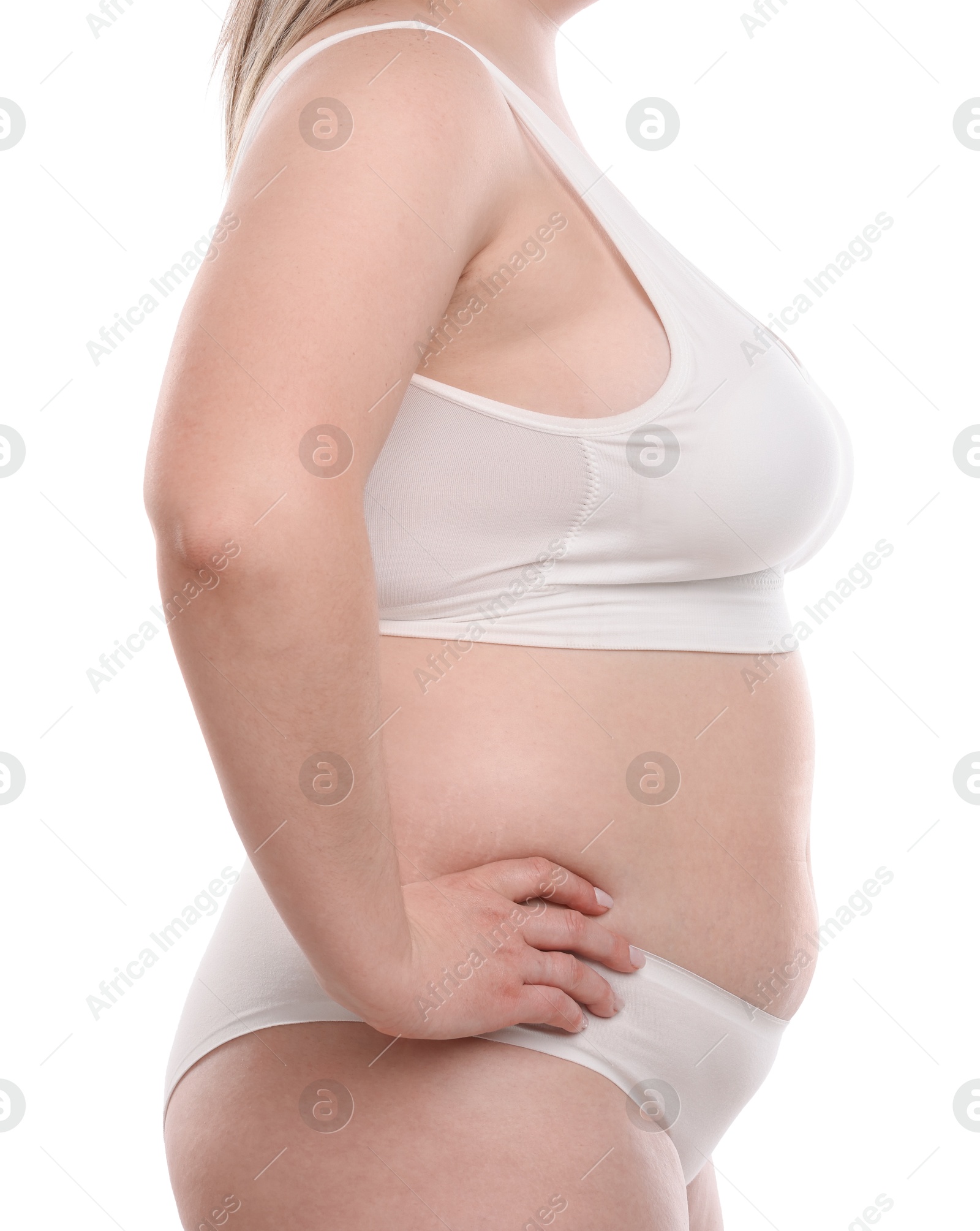 Weight loss. Plus size woman in underwear on white background, closeup Photo of Weight loss. Plus size woman in underwear on white background, closeup