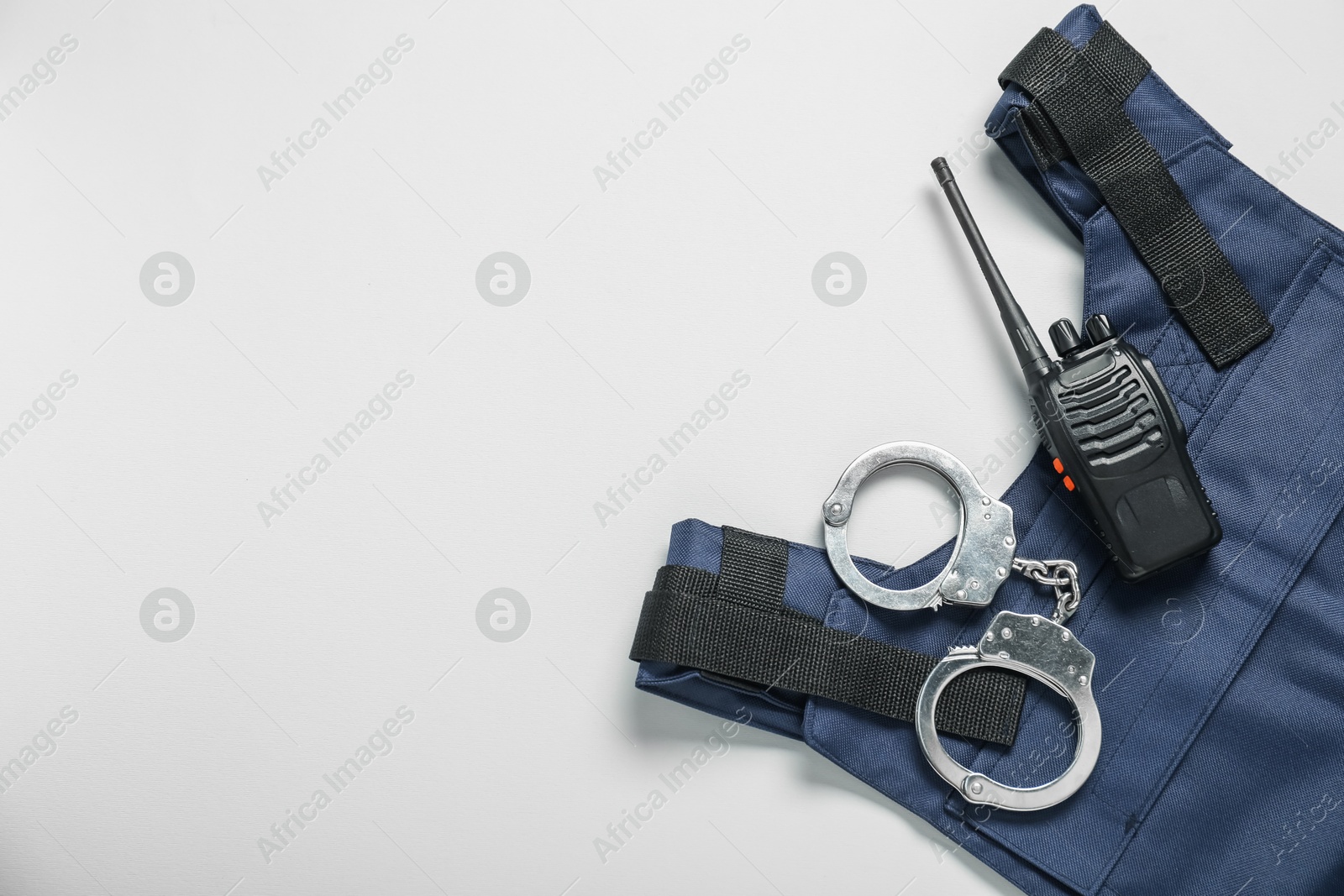 Different police equipment on white background, flat lay. Space for text Photo of Different police equipment on white background, flat lay. Space for text